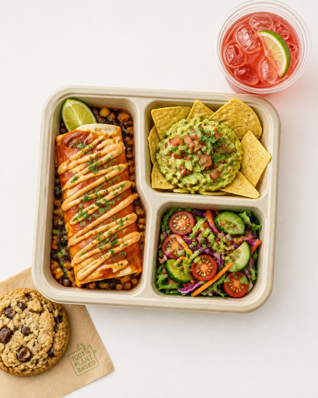 Almuerzo vegano de Lunchera con enchilada, nachos con guacamole, ensalada, bebida y galleta